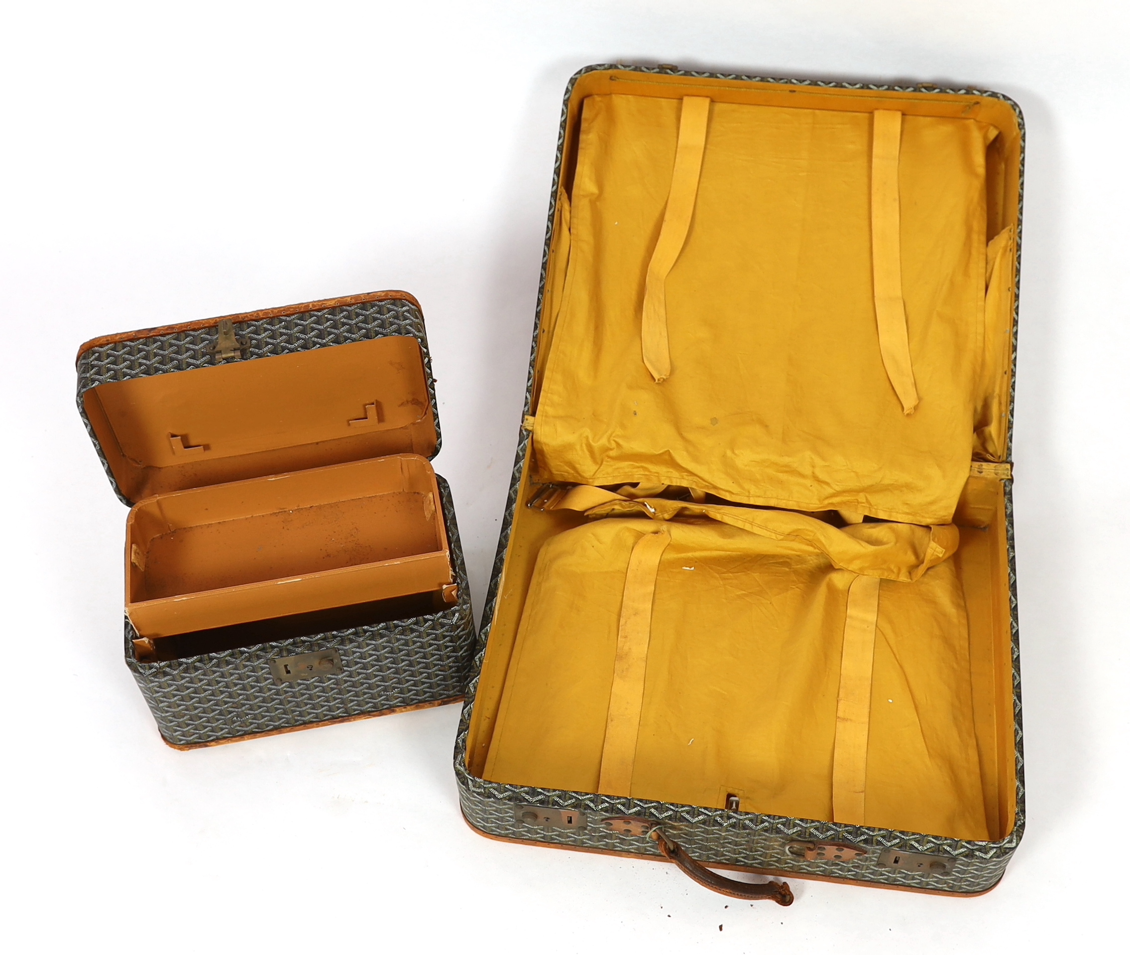 A 1940's Goyard vanity case with matching suitcase, vanity case 37cm wide, 23cm deep, 23cm high; suitcase 59cm wide, 21cm deep, 50cm high